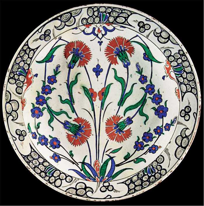 Iznik Tile: An Iznik Carnations and Prunus blossom Polychrome Dish C 1575 Lot 17
